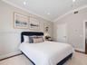 Vaulted ceiling featuring crisp crown molding and recessed lighting