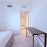 Neutral color palette featuring light-toned tile flooring and white interior walls