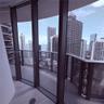 Floor-to-ceiling glass paneling, wraparound balcony with metal railings, and wood-finish flooring