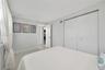 Interior room featuring large-format tile flooring, recessed lighting, and a double-door closet with polished hardware