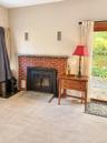 Living room with brick fireplace for the cozy winter nights