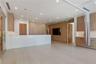 Open-concept interior featuring wood-finish cabinetry, stone-surface countertops, wood-finish flooring, recessed lighting, and wall-mounted hardware