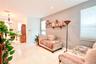 Light-toned tile flooring, recessed ceiling lighting, multi-paneled entry door, and large windows with cellular shades