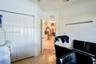 Interior space featuring bi-fold closet doors, neutral wall finish, and wood-finish flooring