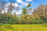 Spacious fenced backyard offers room for outdoor recreation and entertaining.