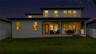 Rear twilight view featuring the covered lanai and inviting outdoor living areas.