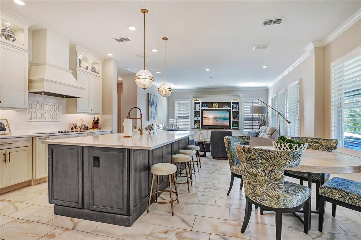 Open kitchen layout connects the island, breakfast nook and family room for everyday living and entertaining.