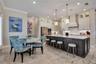 Breakfast nook and generous island seating provide multiple spaces for casual dining and gathering.