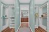 Custom dual closets in the master