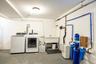 Lower level laundry area.