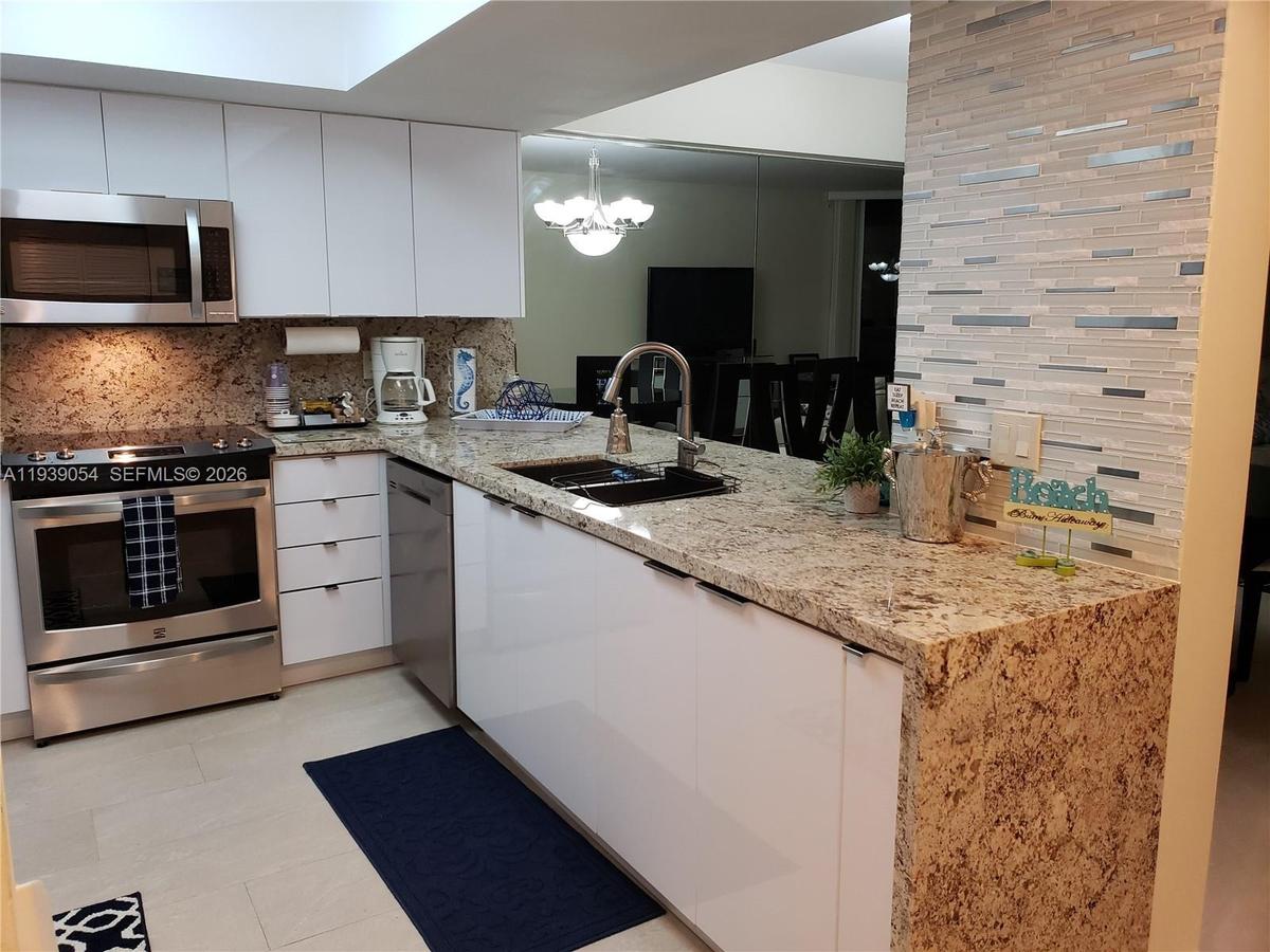 Custom Kitchen Island with WaterFall Granite Counter Tops