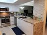 Custom Kitchen Island with WaterFall Granite Counter Tops