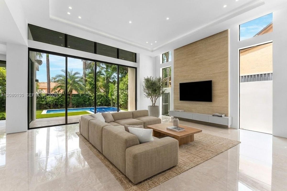 Living Room. Disclaimer: Several photographs presented in this listing contain digitally added furniture, artwork, and decor. These virtually staged i