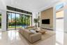 Living Room. Disclaimer: Several photographs presented in this listing contain digitally added furniture, artwork, and decor. These virtually staged i