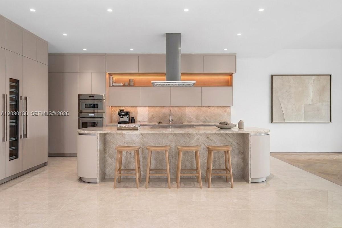 Kitchen. Disclaimer: Several photographs presented in this listing contain digitally added furniture, artwork, and decor. These virtually staged image
