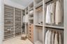 Guest Closet. Disclaimer: Several photographs presented in this listing contain digitally added furniture, artwork, and decor. These virtually staged 