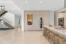Kitchen. Disclaimer: Several photographs presented in this listing contain digitally added furniture, artwork, and decor. These virtually staged image