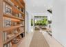Entry. Disclaimer: Several photographs presented in this listing contain digitally added furniture, artwork, and decor. These virtually staged images 