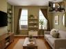 Hardwood-finish flooring features throughout this living space (virtually staged)