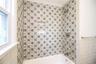 Detail of tub/shower area in hall bath. Photos taken when house was empty prior to occupancy.