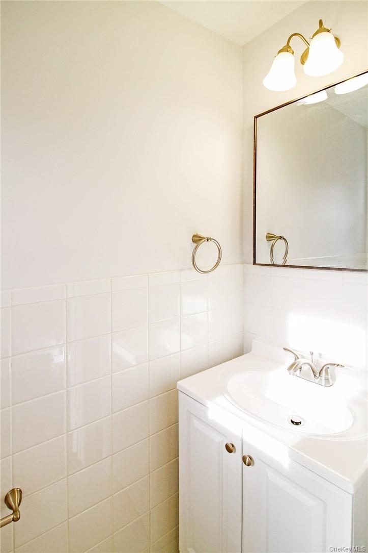 Formal powder room in front hall. Photos taken when house was empty prior to occupancy.