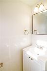 Formal powder room in front hall. Photos taken when house was empty prior to occupancy.