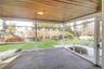 Covered screened porch accessed from great room and opening to yard. Photos taken when house was empty prior to occupancy.