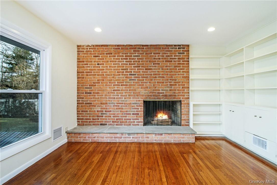 Close up of fireplace and built-ins. Photos taken when house was empty prior to occupancy.