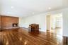 Front entry and spacious great room with fireplace. Photos taken when house was empty prior to occupancy.