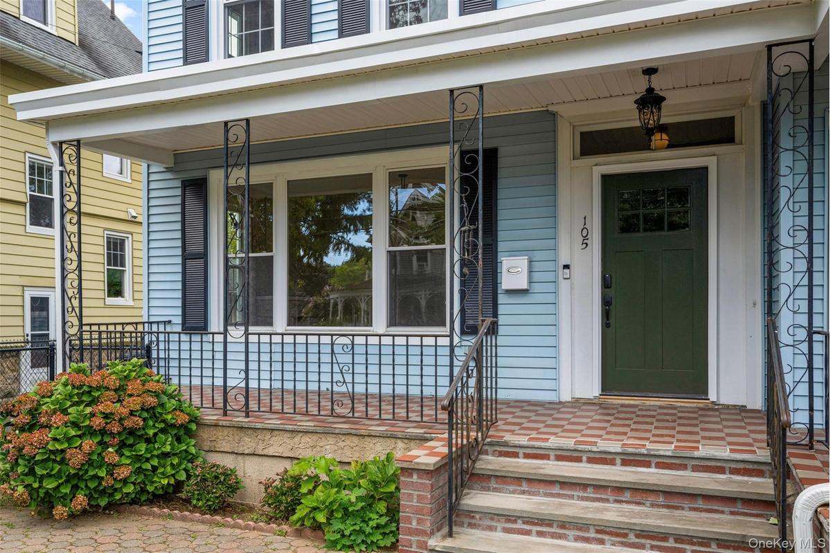 Doorway to residence with a porch