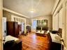1st Floor bedroom featuring light hardwood / wood-style flooring, ornamental molding, and baseboard heating