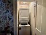 Laundry room with stacked washer and clothes dryer