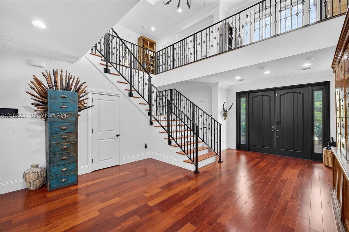 An impressive grand foyer sets the tone for the elegance and sophistication found throughout this residence.