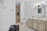 Another beautifully appointed en suite bathroom featuring a spacious vanity tasteful finishes in a walk-in shower with every bedroom enjoying its own 
