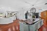 An impressive open concept, dining area offers ample space for a grand dining table, perfect for hosting elegant dinner parties, holiday celebrations 