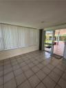 Tile flooring, recessed lighting, and expansive wall-to-wall windows