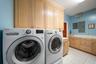 Laundry room w/ refrigerator & freezer
