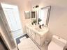 Primary Ensuite Bath with double vanity and sinks.