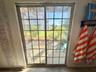 Sliding Doors from the Garage lead to a Private Patio