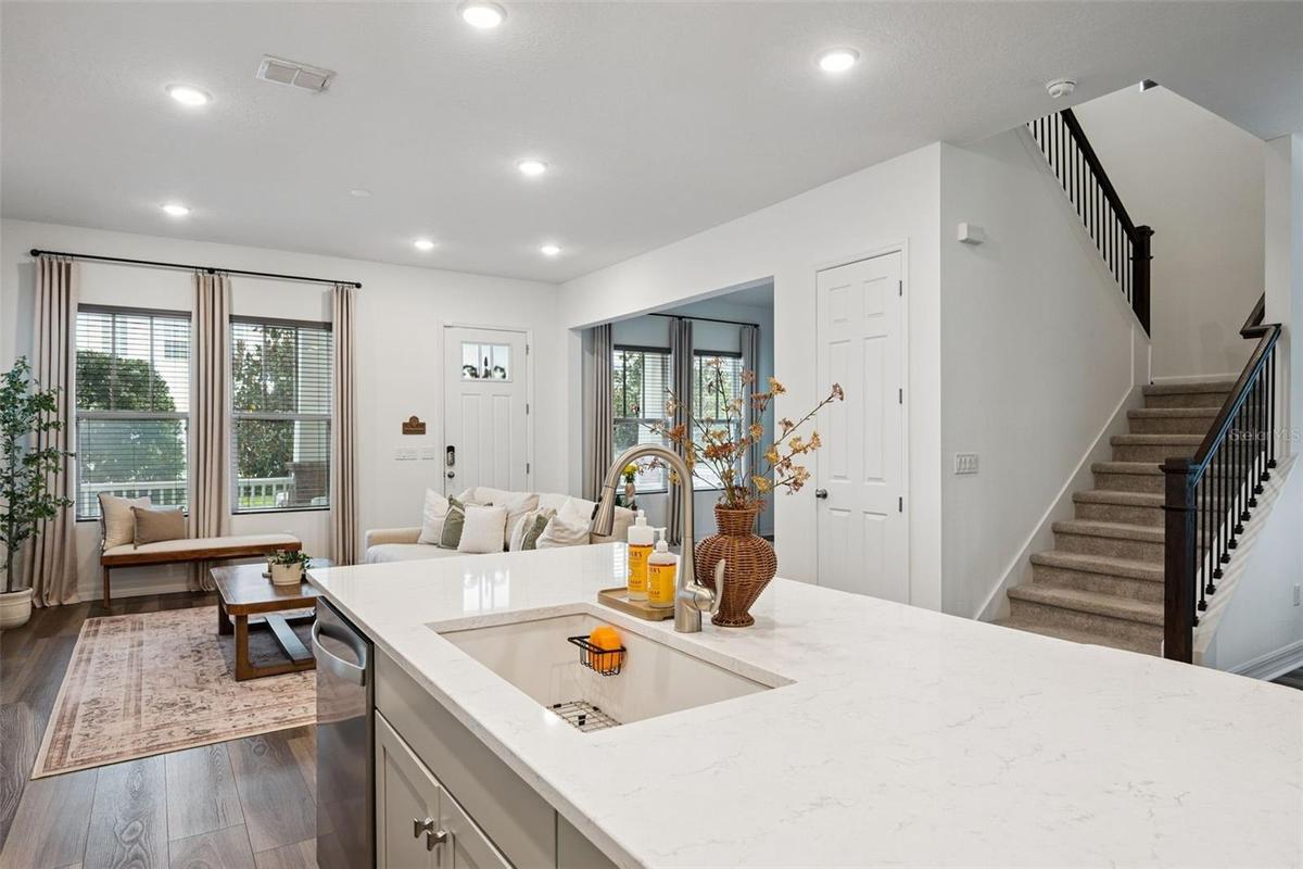Kitchen Overlooks Living and Dining Rooms