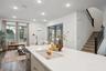 Kitchen Overlooks Living and Dining Rooms