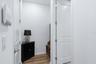 A mudroom area tucked away inside garage door entry