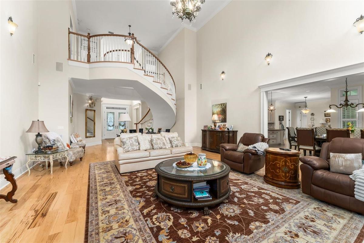 Family room looking back towards foyer & floating staircase