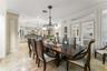 full size dining table in Kitchen area with doors leading out to screened in porch