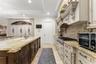 Those aren't cabinets on the far wall, that is the Fridge and freezers