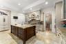 Kitchen with door leading to butlers pantry