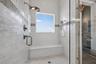Primary Shower with Bench Seat and Multiple Shower Heads