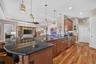 An expansive kitchen peninsula provides generous prep space, perfect for baking, meal prep, or entertaining.