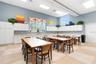 A dedicated community craft room provides a spacious, well-lit studio for artistic projects, crafting, and creative workshops.