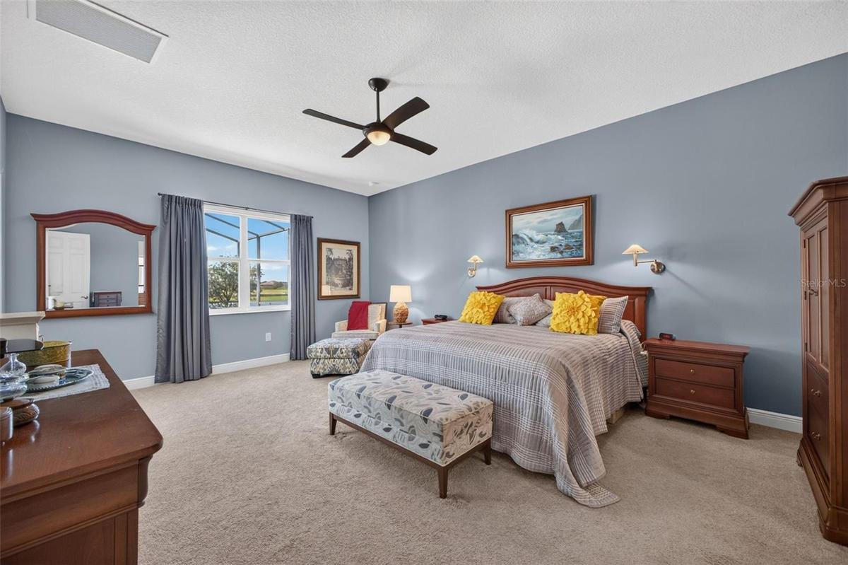Bright, airy, and exceptionally spacious, this primary retreat features generous dual walk-in closets and a beautifully appointed en-suite bathroom.